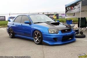 2009 Subaru Impreza with 18x9.5 Rota Grid wheels