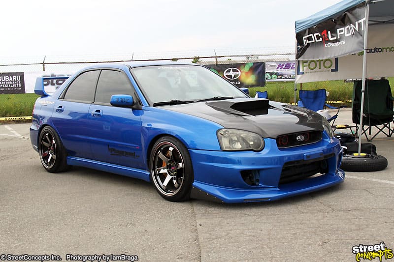 2009 Subaru Impreza with 18x9.5 Rota Grid wheels