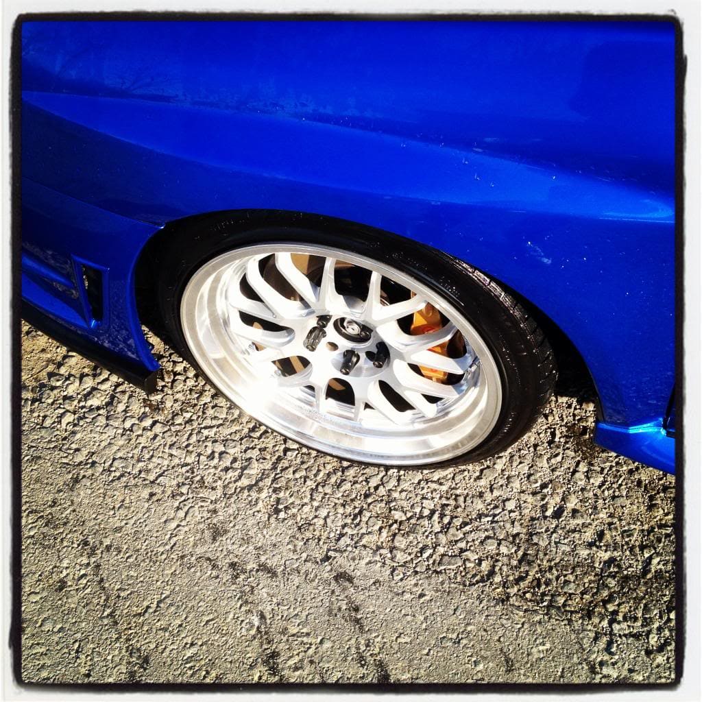 2009 Subaru Impreza with 18x9.5 Rota MXR wheels