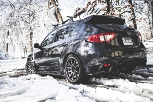 2010 Subaru Impreza with 18x9.5 Rota DPT wheels