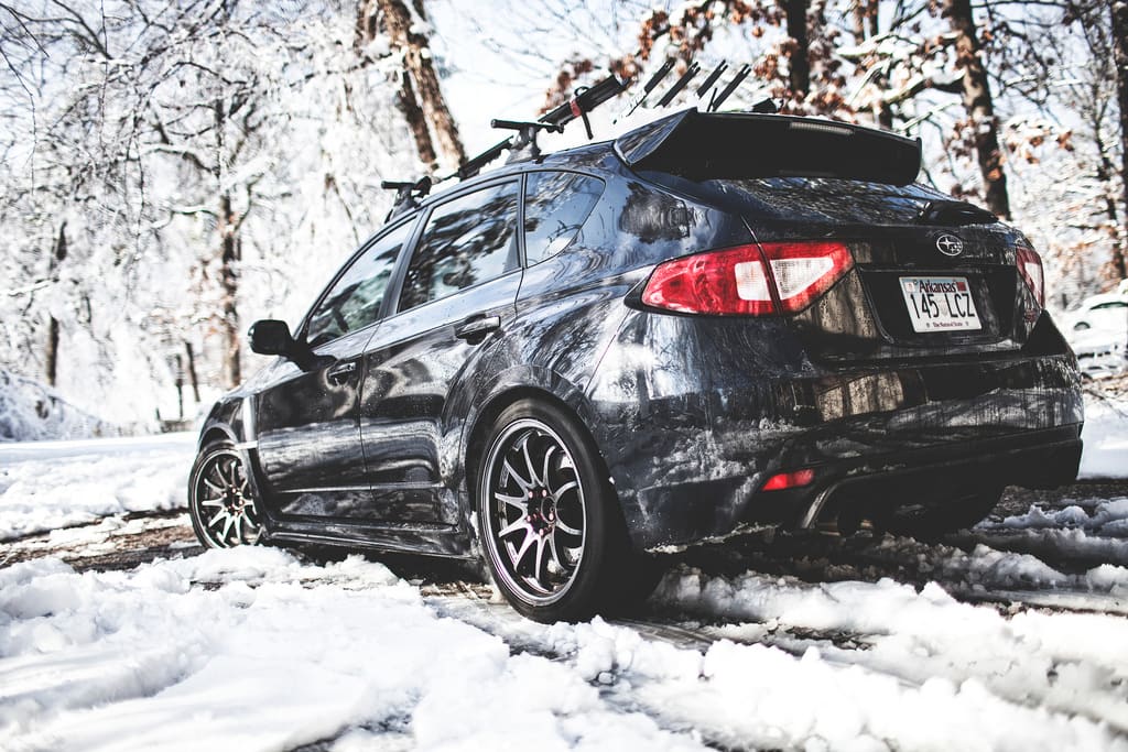 2010 Subaru Impreza with 18x9.5 Rota DPT wheels