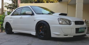 2004 Subaru Impreza with 18x10 Rota RT5 wheels