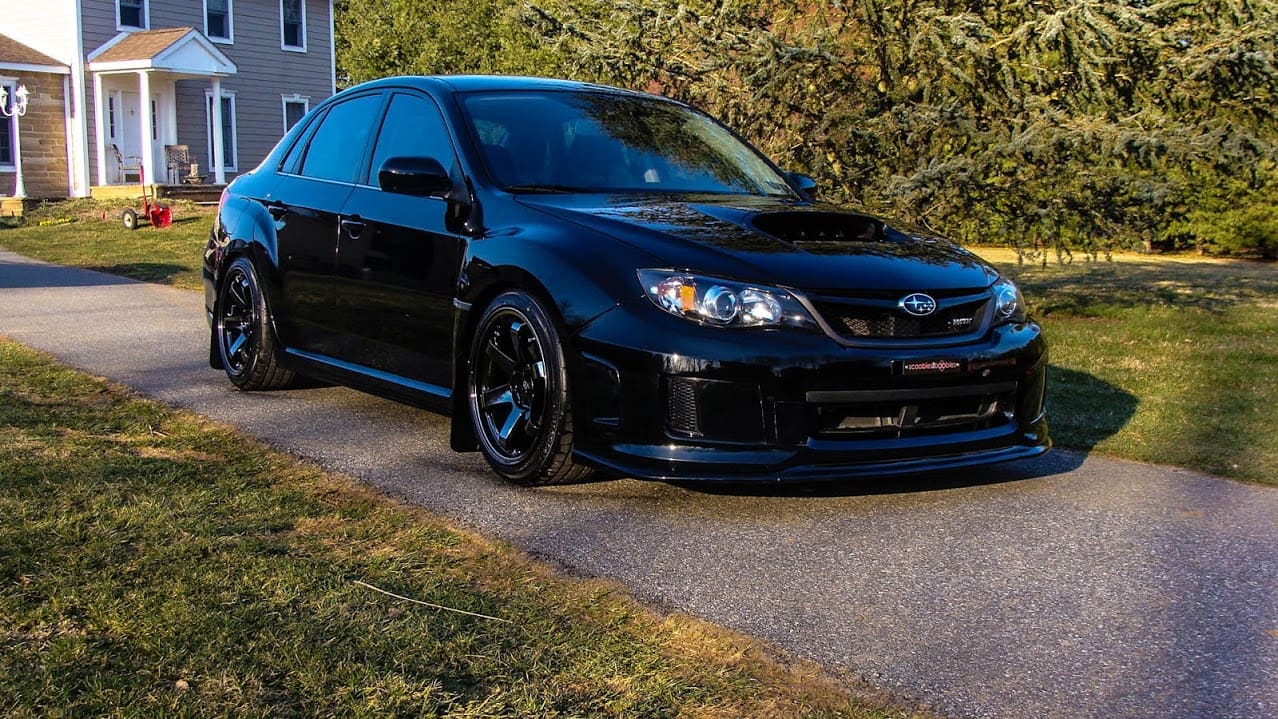 2009 Subaru Impreza with 18x9.5 Rota Grid wheels