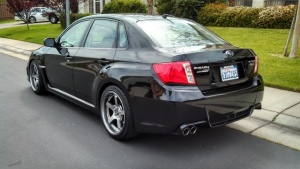 2010 Subaru Impreza with 18x9.5 Rota RT5 wheels