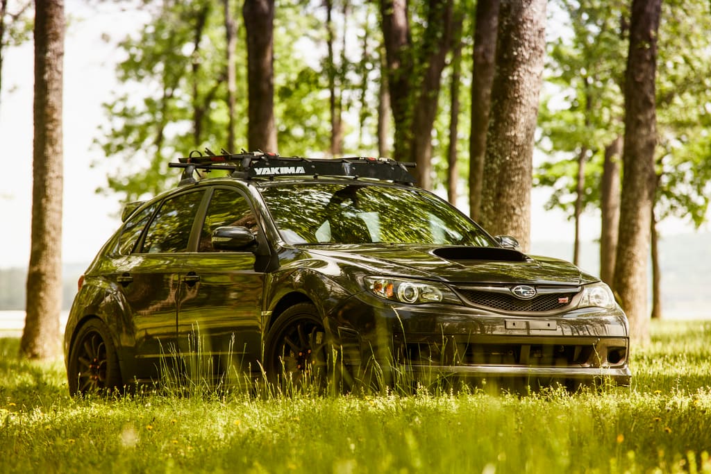 2011 Subaru Impreza WRX with 18x9.5 Rota DPT wheels