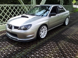 2010 Subaru Impreza with 18x9 Rota G-Force wheels
