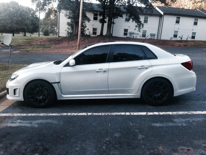 2011 Subaru Impreza WRX with 18x9.5 Rota G-Force wheels
