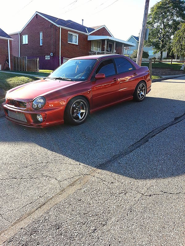 2003 Subaru Impreza with 17x9 Rota RT5 wheels