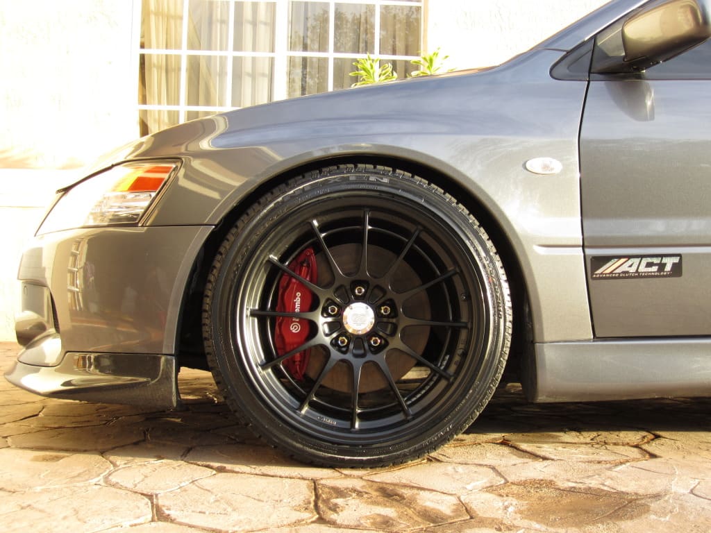 2006 Mitsubishi Lancer Evolution with 18x9.5 Enkei NT03+M wheels