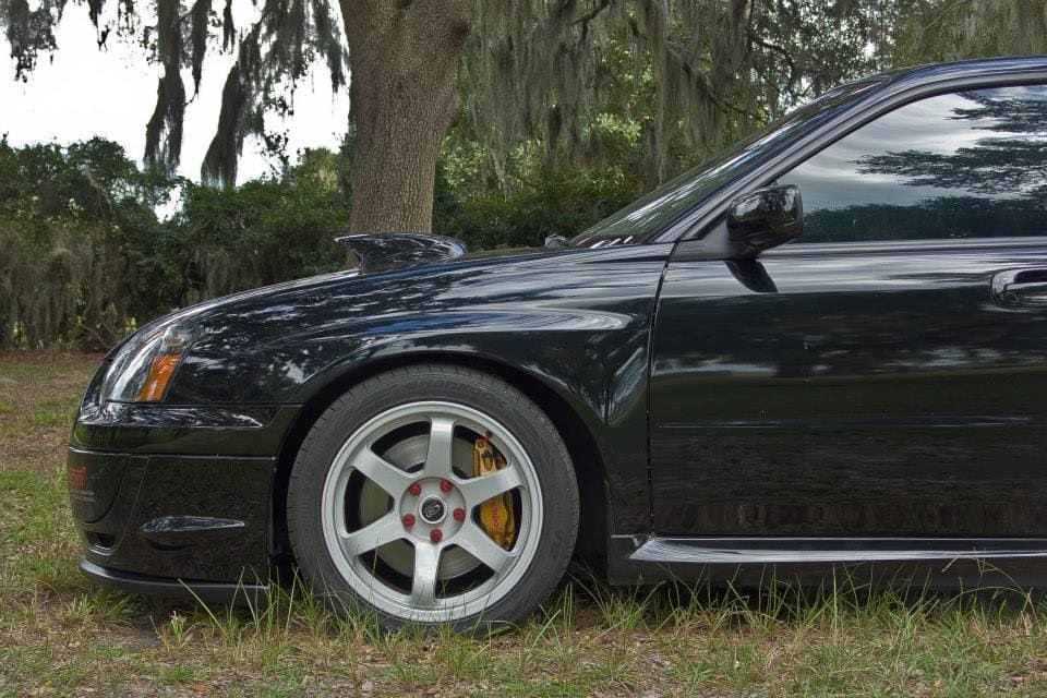 2005 Subaru Impreza with 17x9 Rota Grid wheels