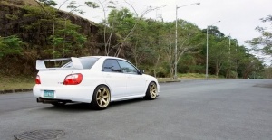 2004 Subaru Impreza with 18x9.5 Rota Grid wheels