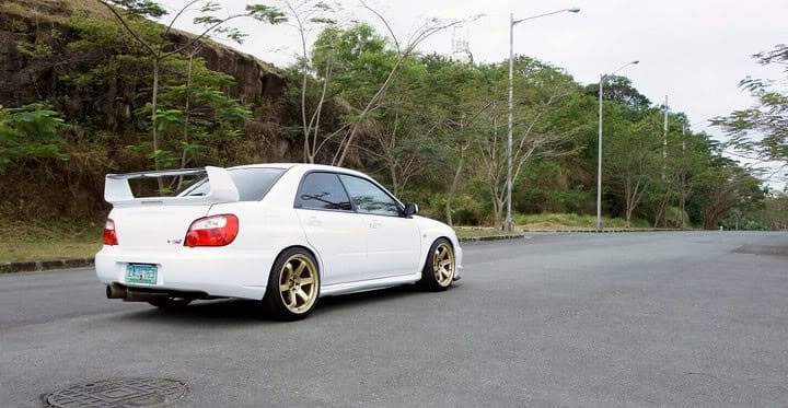 2004 Subaru Impreza with 18x9.5 Rota Grid wheels