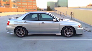 2003 Subaru Impreza with 17x9 Rota Titan wheels