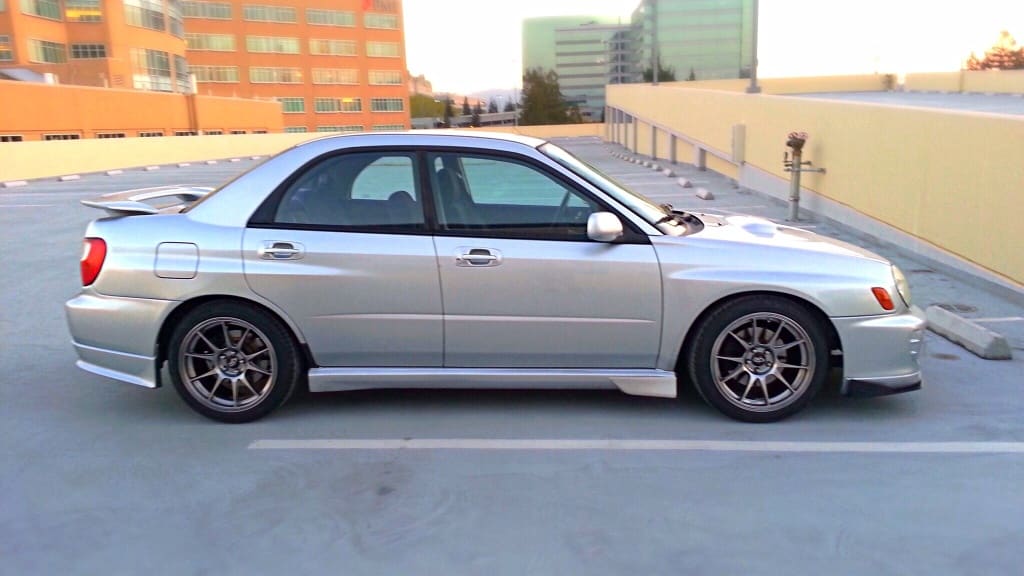 2003 Subaru Impreza with 17x9 Rota Titan wheels