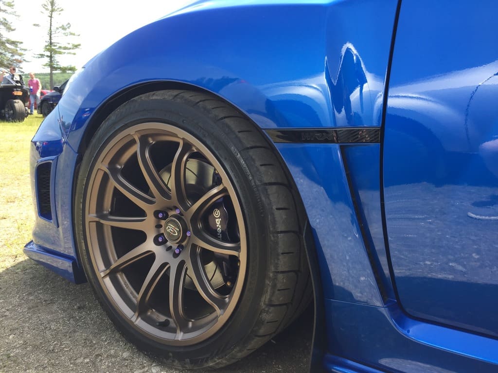 2011 Subaru Impreza WRX with 18x9.5 Rota T2R wheels