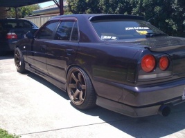 1999 Nissan R31-R34 Skyline 4dr with 18x9.5 Rota Grid wheels