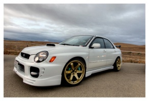 2002 Subaru Impreza WRX with 18x9.5 Rota Grid wheels