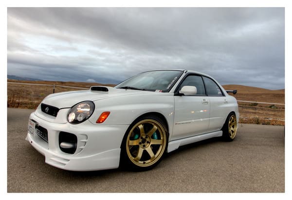 2002 Subaru Impreza WRX with 18x9.5 Rota Grid wheels