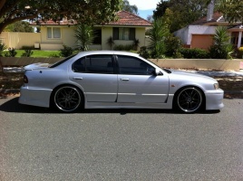 1998 Nissan Maxima with 20x8.5 Exe Pegasus Drift wheels