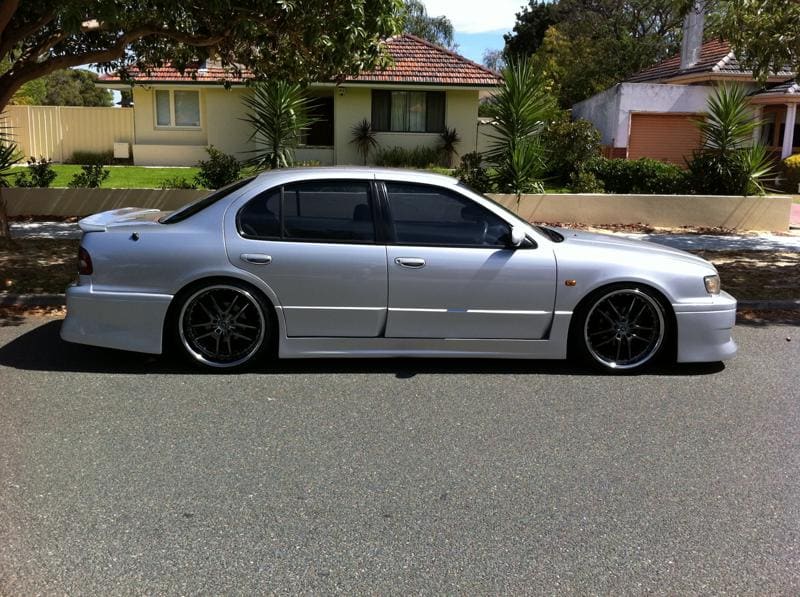 1998 Nissan Maxima with 20x8.5 Exe Pegasus Drift wheels