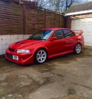 2003 Mitsubishi Lancer Evolution with 17x9.5 Rota Grid wheels