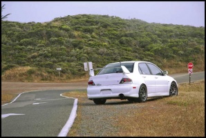 2004 Mitsubishi Lancer Evolution with 17x9 Volk Racing CE28N wheels
