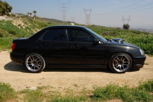 2004 Subaru Impreza WRX with 18x9.5 Rota Torque-R wheels