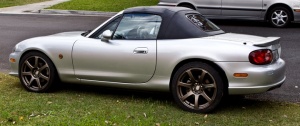 2004 Mazda MX-5 Miata with 17x8 Work Emotion XT7 wheels