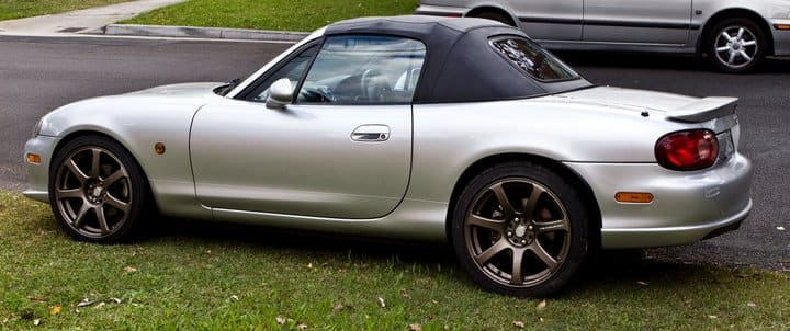2004 Mazda MX-5 Miata with 17x8 Work Emotion XT7 wheels