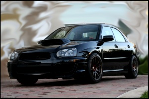 2005 Subaru Impreza WRX with 17x9 Rota Torque-R wheels