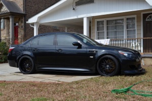 2010 BMW M5 with 20x9 DPE SC16 wheels