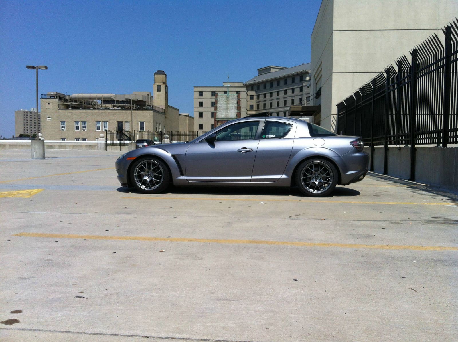 2007 Mazda RX-8 with 18x8.5 Enkei Raijin wheels