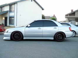 2003 Subaru Impreza WRX with 18x9 Kyowa Evolve wheels