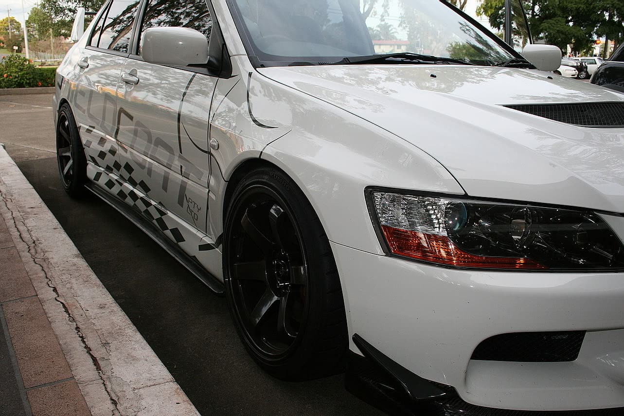 2006 Mitsubishi Lancer Evolution with 18x9.5 Rota Grid Gunmetalic wheels