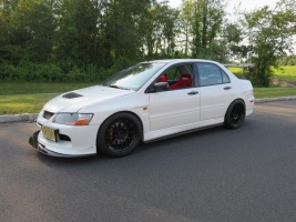 2008 Mitsubishi Lancer Evolution with 18x9.5 Enkei NT03 wheels