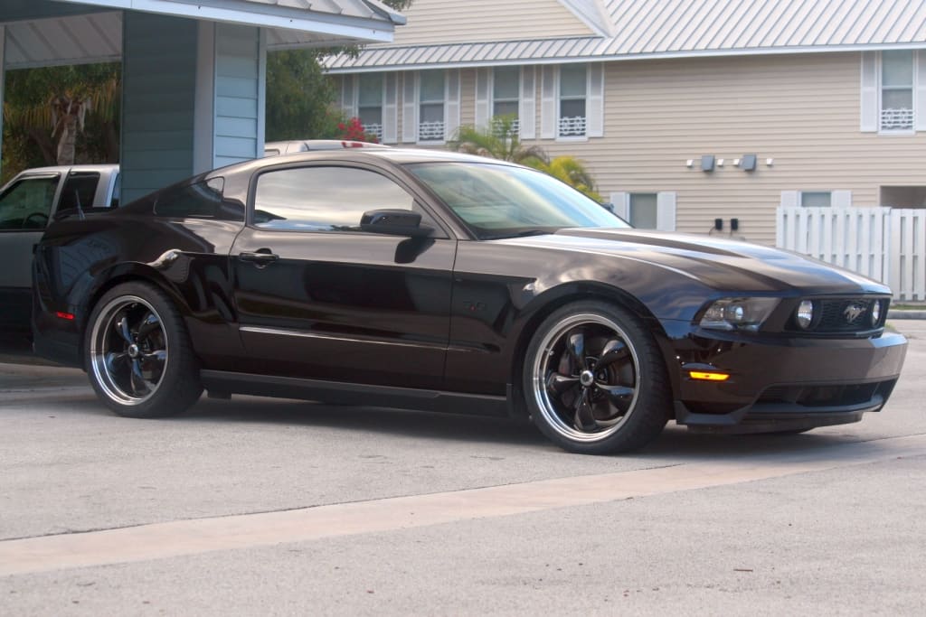 2012 Ford Mustang with 20x8.5 American Racing Torq Thrust M wheels