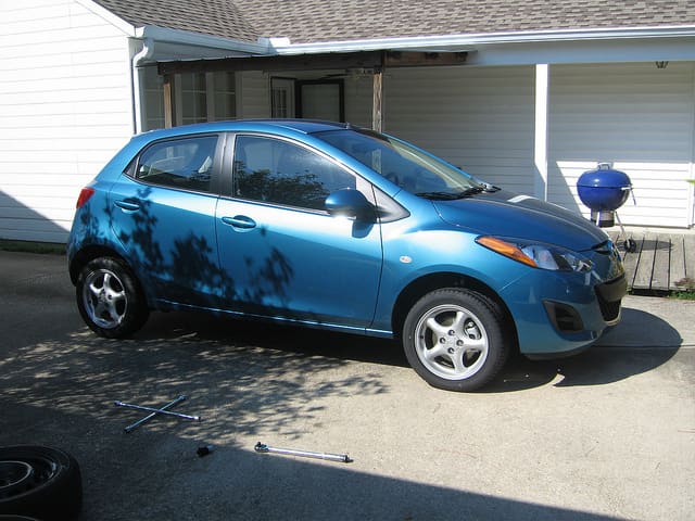 2011 Mazda Mazda2 with 15x6 Miata wheels