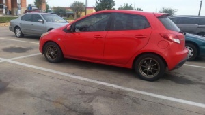 2012 Mazda Mazda2 with 15x6.5 Konig Heliums wheels