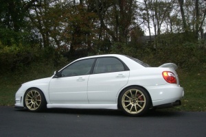 2006 Subaru Impreza WRX with 18x9 Rota G-Force wheels