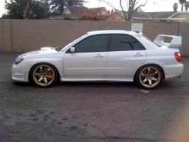 2007 Subaru Impreza WRX STi with 18x9.5 Rota Grid wheels